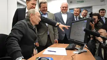 vladimir putin inspects computer terminal